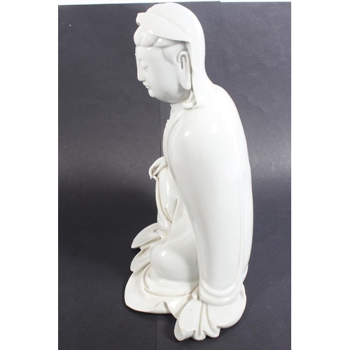 491 - Chinese blanc de chine porcelain figure of Guanyin, modelled in a seated position, 30cm tall, with o... 