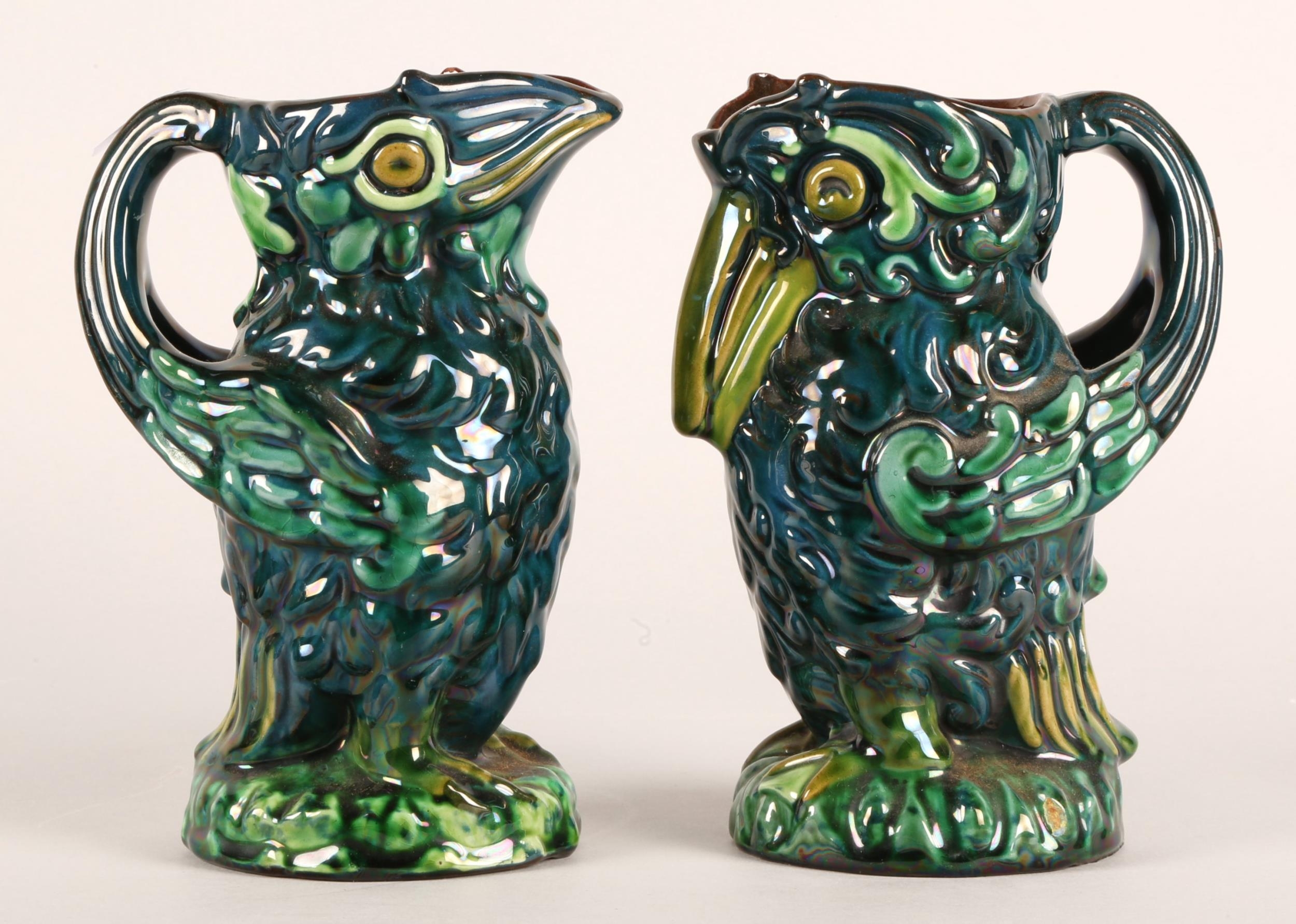 Two Devon Ware 'Grotesque' jugs in the form of birds, each approx. 17cm h.