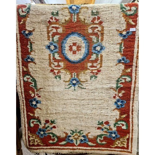 752 - Red and cream ground rug, approx. 185cm x 90cm