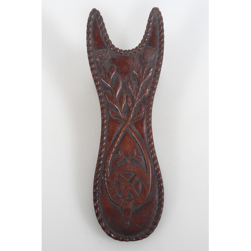 37 - Masonic interest, a carved hardwood boot jack decorated with carved floral design, the reverse with ... 