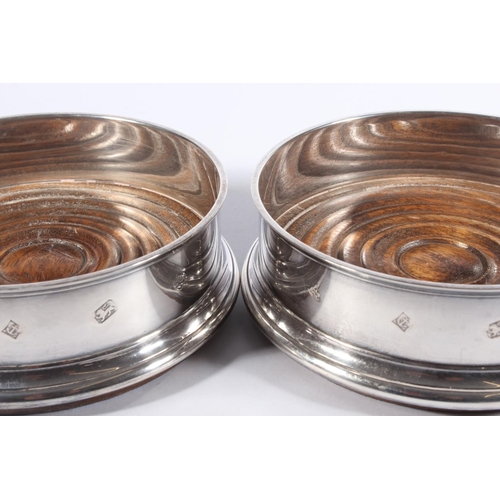 1 - Pair of contemporary silver and oak wine slides with blue fabric bases, Argyll Silver, Birmingham, 1... 