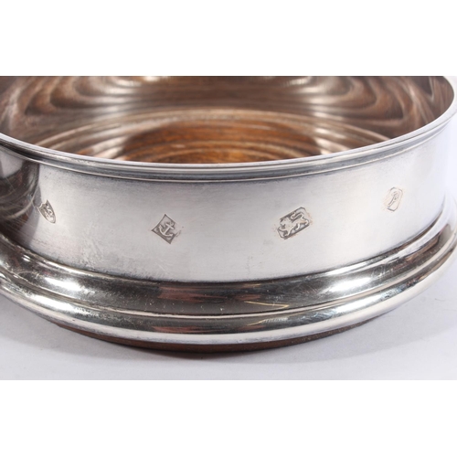 1 - Pair of contemporary silver and oak wine slides with blue fabric bases, Argyll Silver, Birmingham, 1... 