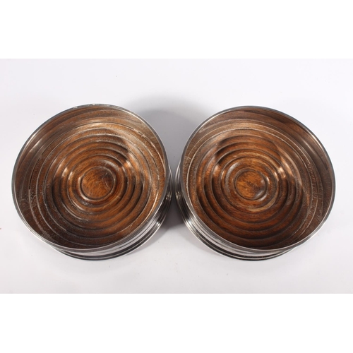 1 - Pair of contemporary silver and oak wine slides with blue fabric bases, Argyll Silver, Birmingham, 1... 