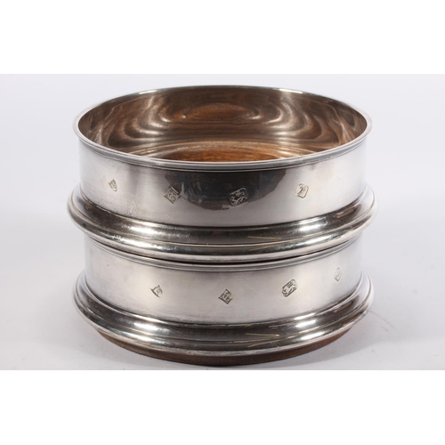 1 - Pair of contemporary silver and oak wine slides with blue fabric bases, Argyll Silver, Birmingham, 1... 