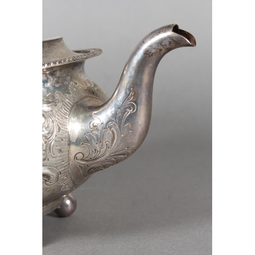 19 - Victorian silver teapot with heavily foliate decorated body and ebonised handle raised on ball suppo... 