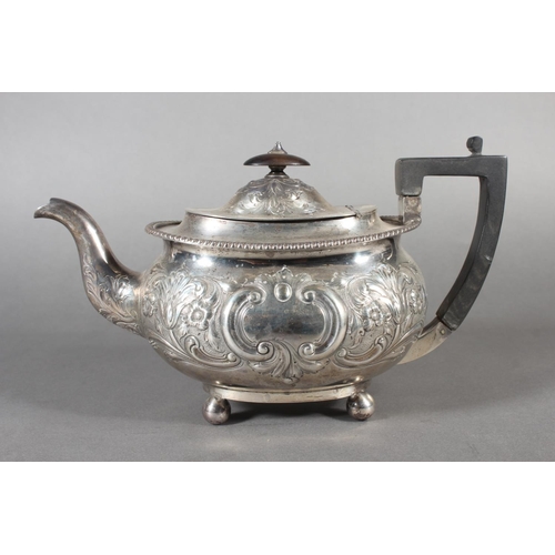 19 - Victorian silver teapot with heavily foliate decorated body and ebonised handle raised on ball suppo... 