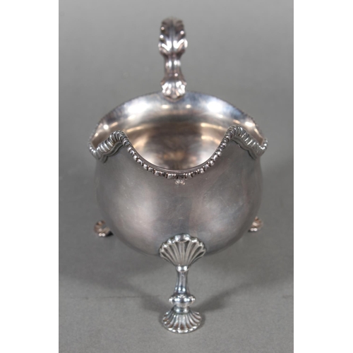 24 - Geo III silver sauce boat with gadrooned edge and raised on three shell shaped feet, Daniel Smith &a... 