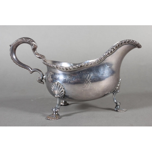 24 - Geo III silver sauce boat with gadrooned edge and raised on three shell shaped feet, Daniel Smith &a... 