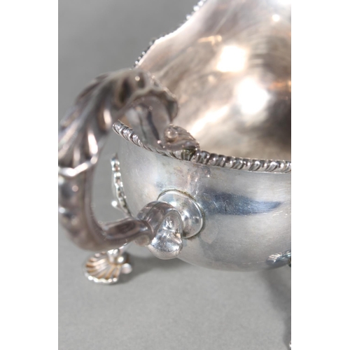 24 - Geo III silver sauce boat with gadrooned edge and raised on three shell shaped feet, Daniel Smith &a... 