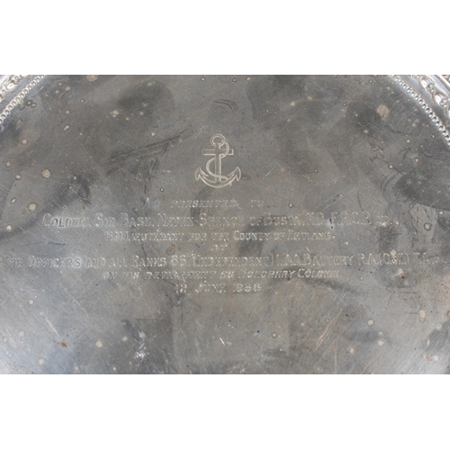 37 - Victorian silver salver with decorative border and raised on tripod supports, Daniel & John Well... 