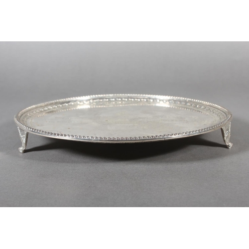 37 - Victorian silver salver with decorative border and raised on tripod supports, Daniel & John Well... 
