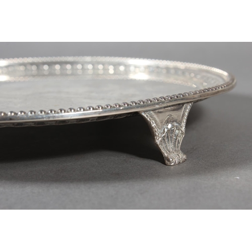 37 - Victorian silver salver with decorative border and raised on tripod supports, Daniel & John Well... 