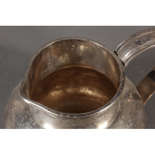 42 - Geo V silver cream jug with loop handle, maker possibly GE or GF, London, 1924, 279g.