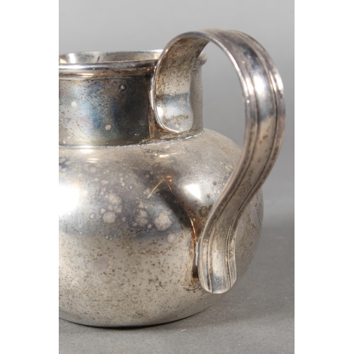 42 - Geo V silver cream jug with loop handle, maker possibly GE or GF, London, 1924, 279g.