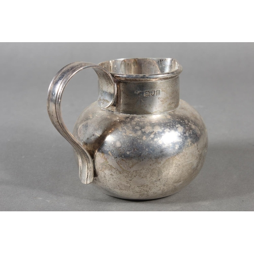 42 - Geo V silver cream jug with loop handle, maker possibly GE or GF, London, 1924, 279g.