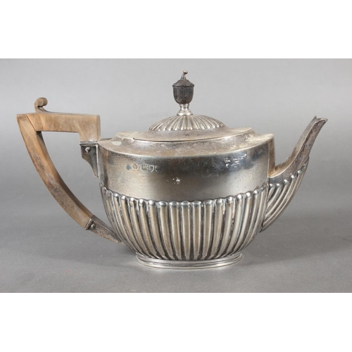 45 - Harlequin three piece silver teaset of half gadrooned form, the teapot by William Hutton & Sons ... 