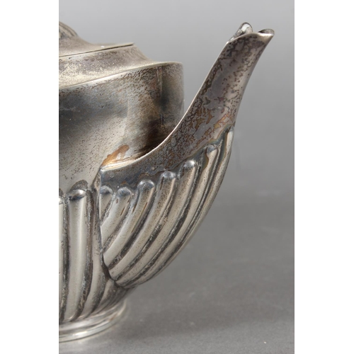 45 - Harlequin three piece silver teaset of half gadrooned form, the teapot by William Hutton & Sons ... 