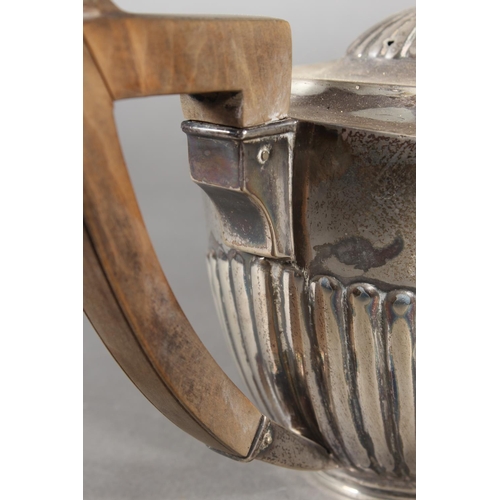 45 - Harlequin three piece silver teaset of half gadrooned form, the teapot by William Hutton & Sons ... 