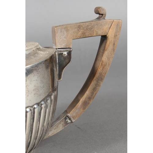 45 - Harlequin three piece silver teaset of half gadrooned form, the teapot by William Hutton & Sons ... 