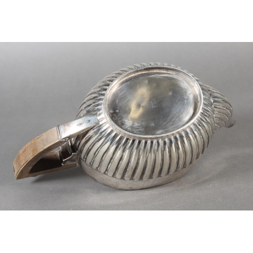 45 - Harlequin three piece silver teaset of half gadrooned form, the teapot by William Hutton & Sons ... 