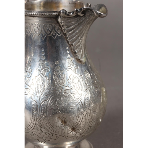 48 - Victorian silver three piece tea service with heavy foliate decoration, loop handle and knop to the ... 