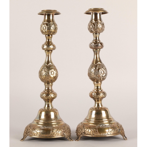 118 - Pair of George V silver candlesticks, J.R, London 1918-19, with knopped stem embossed with flowerhea... 