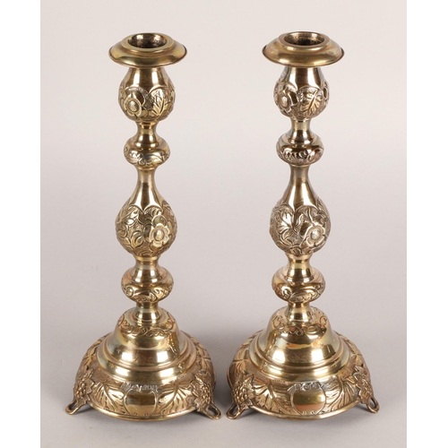 118 - Pair of George V silver candlesticks, J.R, London 1918-19, with knopped stem embossed with flowerhea... 