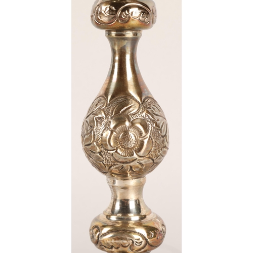118 - Pair of George V silver candlesticks, J.R, London 1918-19, with knopped stem embossed with flowerhea... 