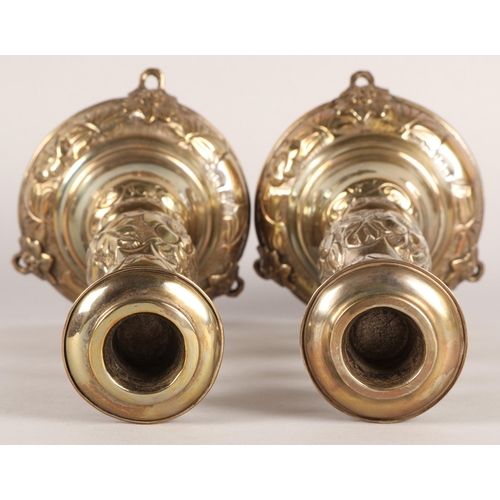 118 - Pair of George V silver candlesticks, J.R, London 1918-19, with knopped stem embossed with flowerhea... 