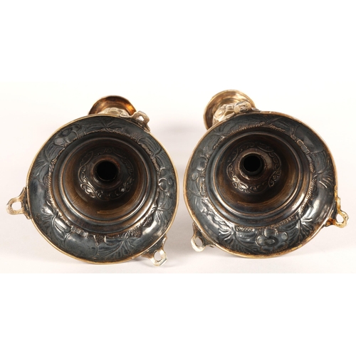 118 - Pair of George V silver candlesticks, J.R, London 1918-19, with knopped stem embossed with flowerhea... 