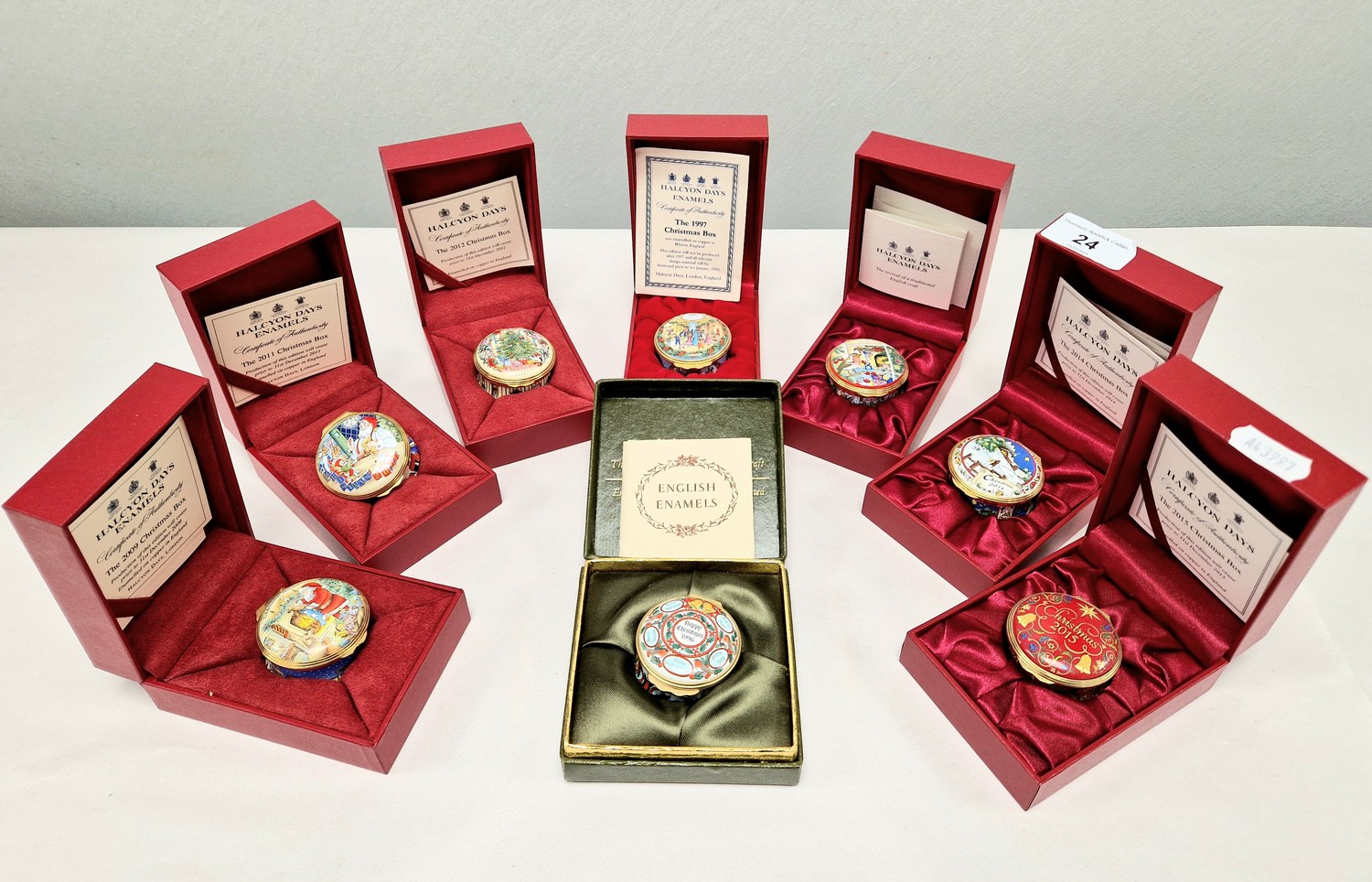Eight Halcyon Days enamelled Christmas boxes, ranging from the years ...