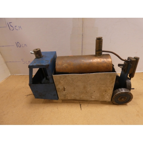 Clockwork locomotive, another locomotive, Mamod steam engine and a ...