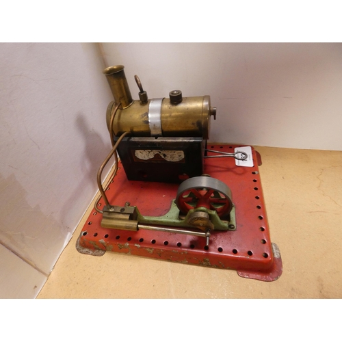 Clockwork locomotive, another locomotive, Mamod steam engine and a ...
