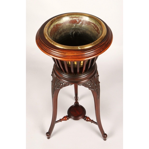 356 - Mahogany jardiniere stand with brass insert, 83cm high, 37cm diameter