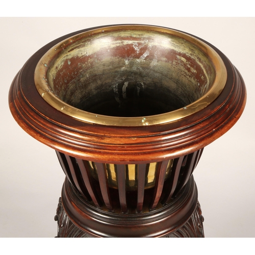 356 - Mahogany jardiniere stand with brass insert, 83cm high, 37cm diameter
