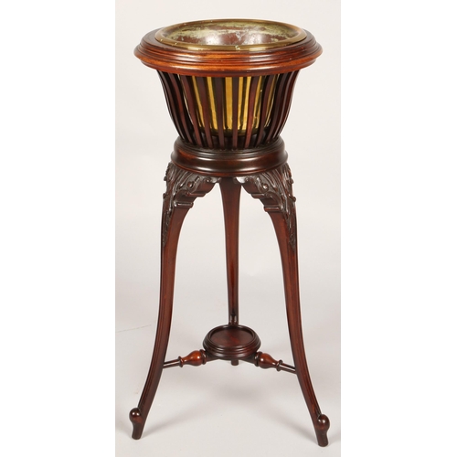 356 - Mahogany jardiniere stand with brass insert, 83cm high, 37cm diameter
