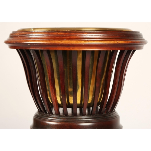 356 - Mahogany jardiniere stand with brass insert, 83cm high, 37cm diameter