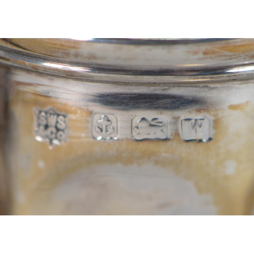 33 - George V silver christening mug with faceted dimples, scroll handle, on octagonal foot, by SW Smith ... 