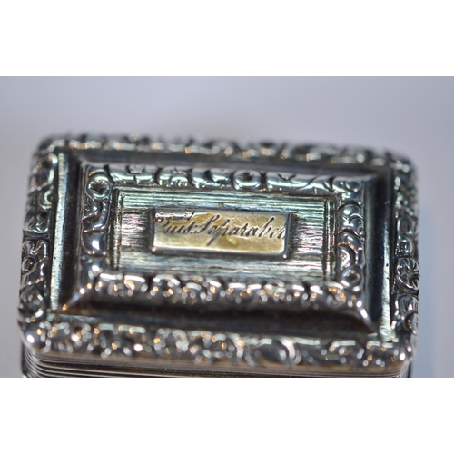 38 - Two Georgian silver vinaigrettes, c. 1820s, each with an engraved cartouche to the hinged top and gi... 