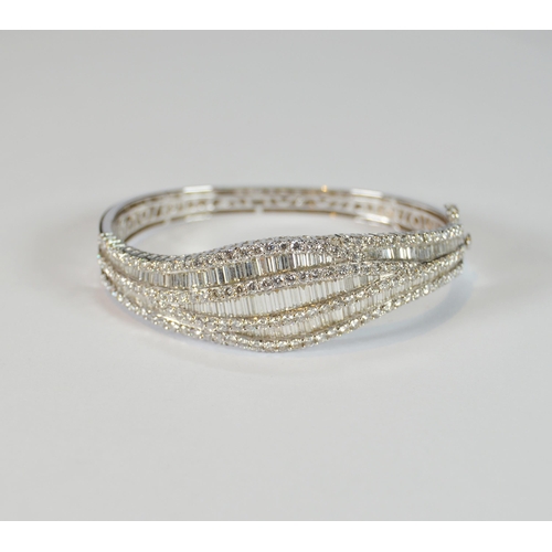 68 - Diamond hinged bangle, baguette and brilliant-cut, in white gold, 36.2g gross.
