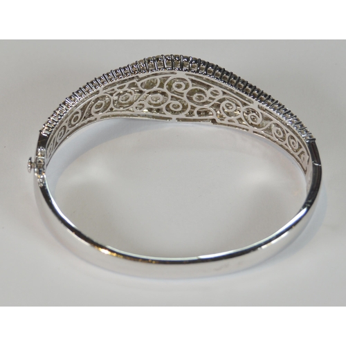 68 - Diamond hinged bangle, baguette and brilliant-cut, in white gold, 36.2g gross.