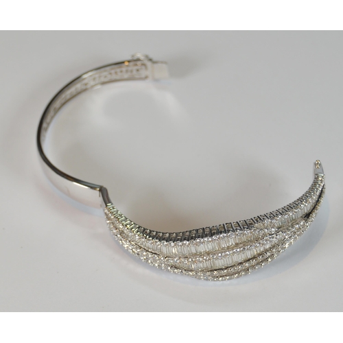 68 - Diamond hinged bangle, baguette and brilliant-cut, in white gold, 36.2g gross.