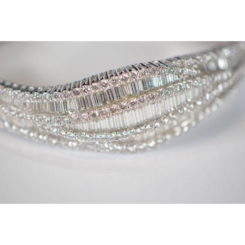 68 - Diamond hinged bangle, baguette and brilliant-cut, in white gold, 36.2g gross.