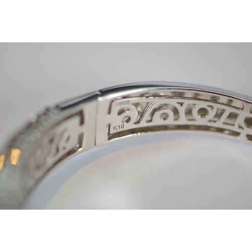 68 - Diamond hinged bangle, baguette and brilliant-cut, in white gold, 36.2g gross.