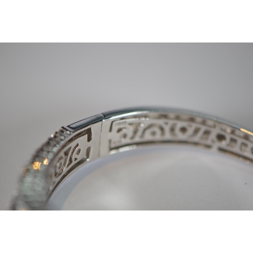 68 - Diamond hinged bangle, baguette and brilliant-cut, in white gold, 36.2g gross.