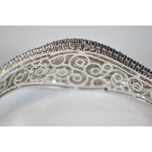 68 - Diamond hinged bangle, baguette and brilliant-cut, in white gold, 36.2g gross.