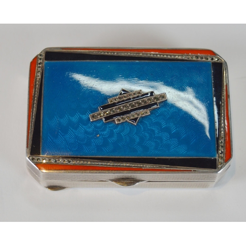 43 - Art Deco blue, orange and black enamelled silver compact containing lipstick and powder within, engi... 
