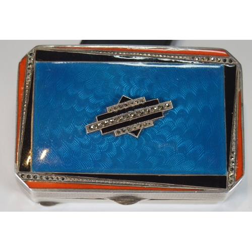 43 - Art Deco blue, orange and black enamelled silver compact containing lipstick and powder within, engi... 
