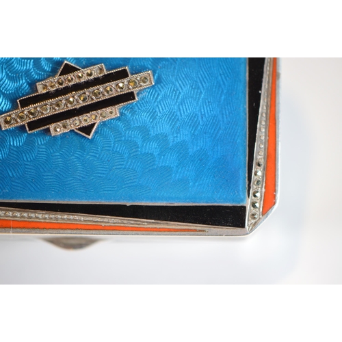 43 - Art Deco blue, orange and black enamelled silver compact containing lipstick and powder within, engi... 