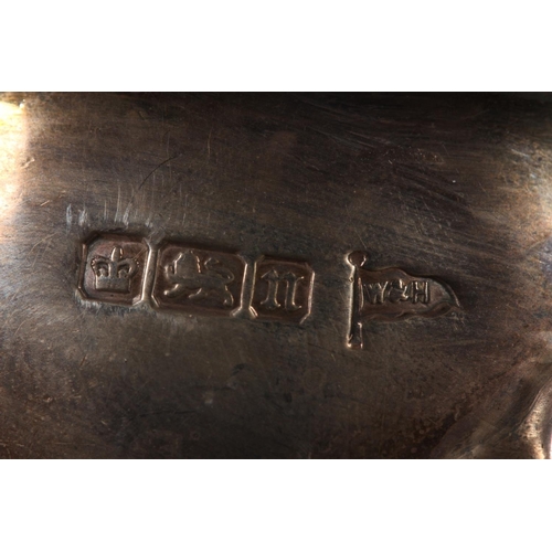 53 - Silver sauce boat with wavy edged rim raised on paw supports with scrolling handle, Walker & Hal... 